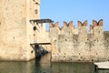 Canal under drawbridge on castle Castello di Sirmione