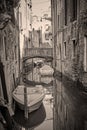 Canal in Venice with bridge and boats Royalty Free Stock Photo