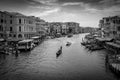 Venice canal and gondola and boats from the Rialto Bridge in black and white