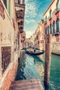 Canal in Venice, Italy with gondolier rowing gondola Royalty Free Stock Photo