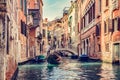 Canal in Venice, Italy with gondolier rowing gondola Royalty Free Stock Photo