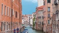 Canal in Venice timelapse. Channel, bridges, historical, old houses and boats. Venice, Italy