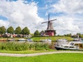 Canal and windmill on fortifications of fortified town of Dokkum, Friesland, Netherlands