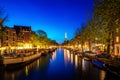 Canals of Amsterdam at night in Netherlands. Amsterdam is the capital and most populous city of the Netherlands Royalty Free Stock Photo