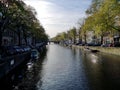 Canals, bikes and houses of Amsterdam city, in Holland, Netherlands Royalty Free Stock Photo