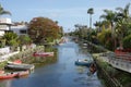Canals, Homes, and a Bridge Crossing the Canal of Venice, California During a Sunny Day