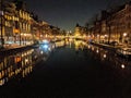 Canals and houses of Amsterdam city at night, in Holland, Netherlands Royalty Free Stock Photo