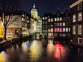 Canals and houses of Amsterdam city at night, in Holland, Netherlands Royalty Free Stock Photo