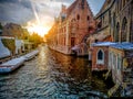 Canals of the medieval city of Brugge using the typical boats over canals in Belgium Royalty Free Stock Photo