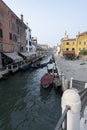 The canal in Venice with gondolas and boats, traditional vehicels of transport in Venice, Italy Royalty Free Stock Photo