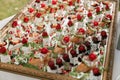 Canape appetizers with strawberries and Brie soft cheese