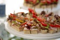 Canape with bacon. light snacks at the banquet. wooden handle.