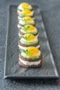 Canape with fried quail eggs Royalty Free Stock Photo