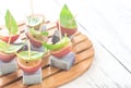 Canape with lavender cheese, grapes and basil