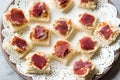 Canape with Pastrami / Pastirma Ham and Hummus on Small Square Bread. Royalty Free Stock Photo