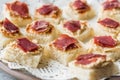 Canape with Pastrami / Pastirma Ham and Hummus on Small Square Bread. Royalty Free Stock Photo