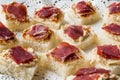 Canape with Pastrami / Pastirma Ham and Hummus on Small Square Bread. Royalty Free Stock Photo