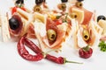 Canape with prosciutto and olives