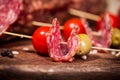 Canape with salami, tomato and olive Royalty Free Stock Photo