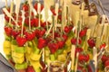 Canape on skewers with strawberry kiwi and pineapple