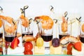 canapes of cheese with fruit, fish with tomatoes and shrimp with sauce in glass. Royalty Free Stock Photo