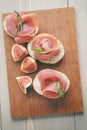 Canapes with jamon and figs on table Royalty Free Stock Photo
