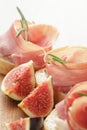 Canapes with jamon and figs on wooden board Royalty Free Stock Photo