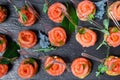 Canapes of red fish, bread, colored salt and herbs on skewers Royalty Free Stock Photo