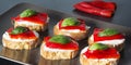 Canapes with roasted peppers, cream cheese and basil Royalty Free Stock Photo