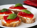 Canapes with roasted peppers, cream cheese and basil Royalty Free Stock Photo