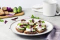 CanapÃÂ©s with toasted bread with sunflower and flax seeds, feta cheese, cucumber and onion