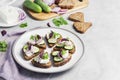 CanapÃÂ©s with toasted bread with sunflower and flax seeds, feta cheese, cucumber and onion