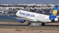 Airbus A321 of Thomas Cook airlines arriving at the airport and landing rollout