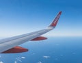 Canary Island, Spain, December 17, 2019: Aerial view from airplane window on wing of Easyjet airlines and blue atlantic Royalty Free Stock Photo