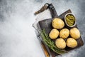 Canary Islands dish Papas Arrugadas, wrinkly potatoes with Mojo verde green sauce. White background. Top view. Copy Royalty Free Stock Photo