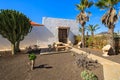 Canary style buildings and tropical plants in La Oliva village Heritage Art Center, Fuerteventura, Canary Islands, Spain Royalty Free Stock Photo