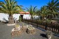 Canary style buildings and tropical plants in La Oliva village Heritage Art Center, Fuerteventura, Canary Islands, Spain Royalty Free Stock Photo