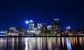 Canary wharf across the Thames at night