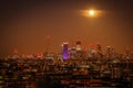 Canary Wharf in London at night, full moon Royalty Free Stock Photo