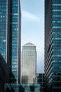 Canary Wharf Financial district tall modern silver metal chrome stainless steel office block tower skyscraper surrounded by glass