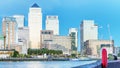 Canary Wharf night skyline with Thames river reflections, London