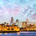 Canary Wharf night skyline with Thames river reflections, London