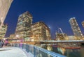 Canary Wharf skyline from street level at night, London UK Royalty Free Stock Photo