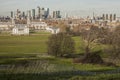 Canary Wharf - a view from the Greenwich park, fences and trees.