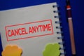 Cancel Anytime write on a book isolated on blue background