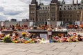 Cancel Canada day protest in Ottawa Canada in 2021 on Parliament Hill in downtown. Shoes and toys left near the Centennial Flame