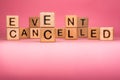 Cancel word on wooden cubes. Cancelled word made with building blocks. Mass gathering cancelled. Repatriation and