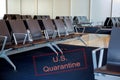 Canceled travel US quarantine with coronavirus COVID-19 empty airport departure lounge terminal waiting area with chairs Royalty Free Stock Photo