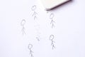 Cancellation culture concept. The drawn figure of a person is erased with an eraser Royalty Free Stock Photo