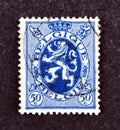 Cancelled postage stamp printed by Belgium, that shows coat of arms Royalty Free Stock Photo